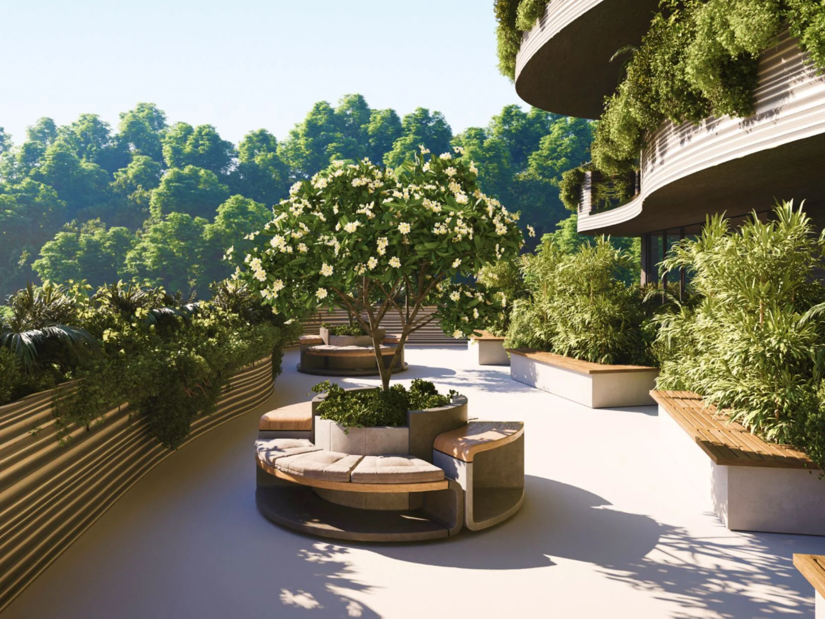 Landscaped terrace with seating area and flowering tree at Sunny Moon, Nai Ha