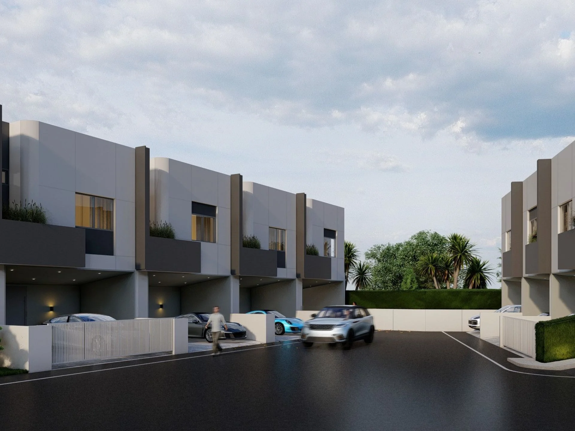 Arquitectura moderna de casa adosada con garajes integrados en Midori Townhome, Phuket