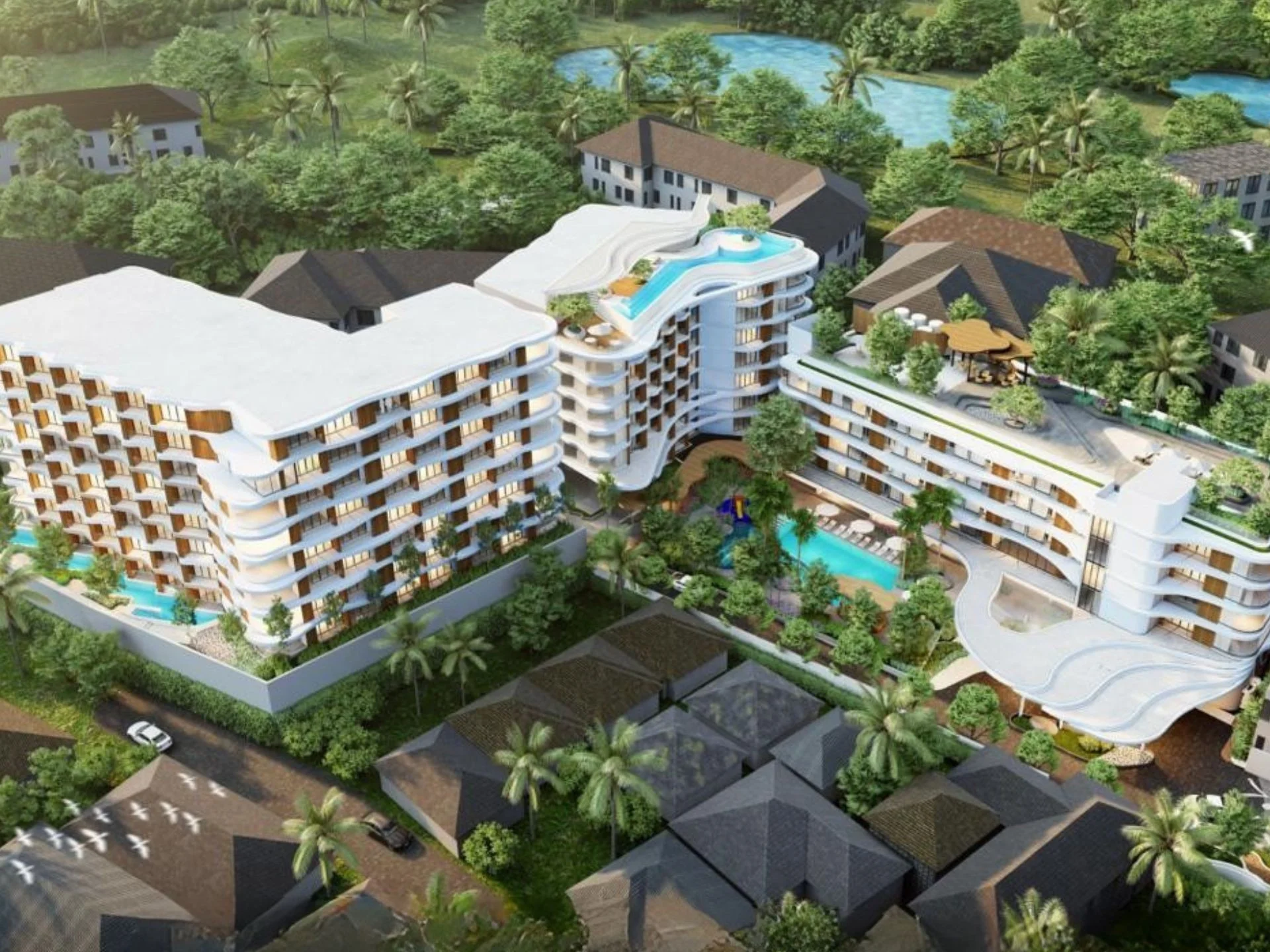 Вид с воздуха на комплекс VIBE Residence Karon с жилыми зданиями и бассейнами
